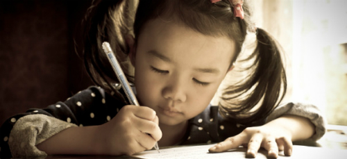little girl writing scientist
